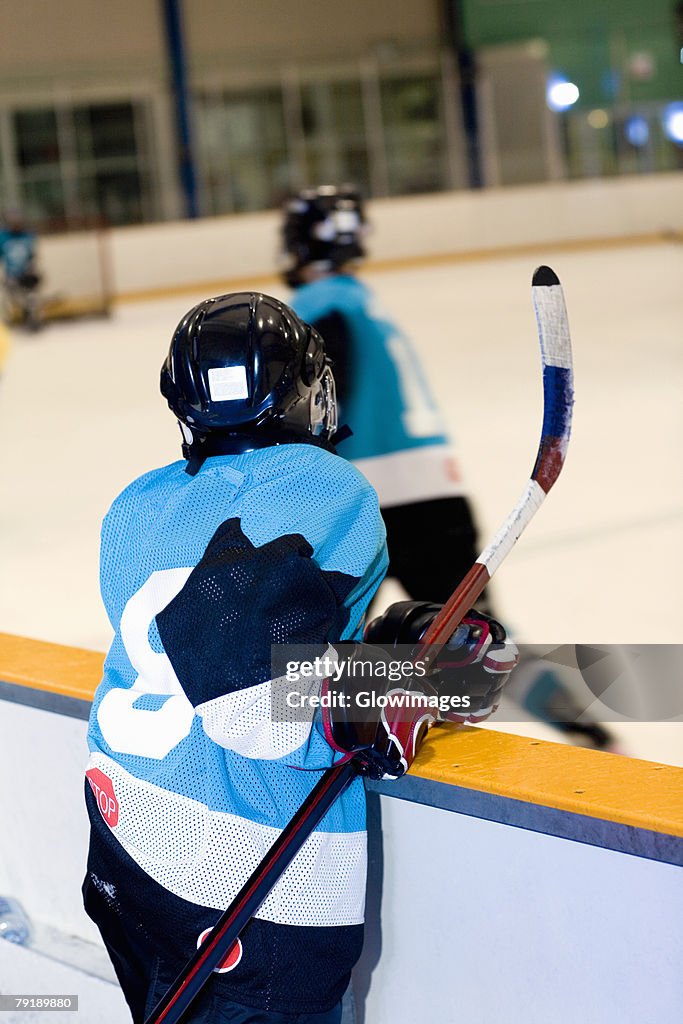 Rear view of an ice hockey player watching ice hockey