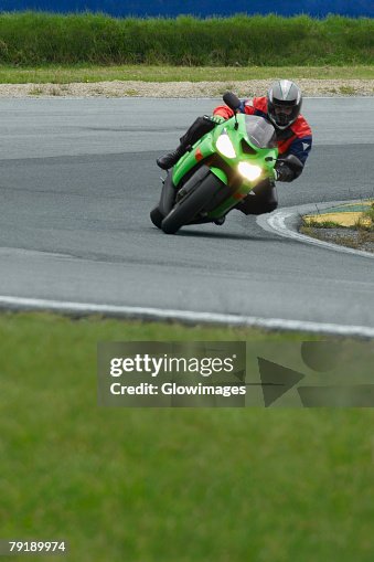 Motorbikes Riding Track Person Riding A Motorcycle On A Motor Racing Track High-Res Stock Photo ...