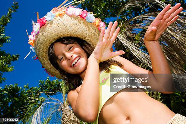 portrait of a girl hula dancing and smiling - belly dancing stockfoto's en -beelden