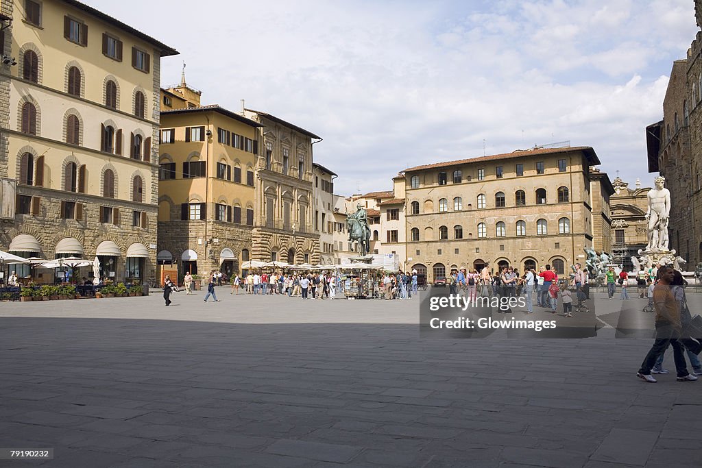 Tourists in front of a palace, Cosme I de Medicis, Pallazo Vecchio, Florence, Italy