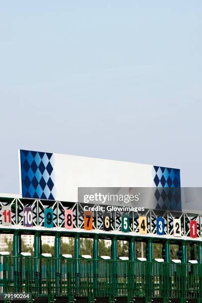 empty starting gates at the horseracing track - horseracing track stock pictures, royalty-free photos & images