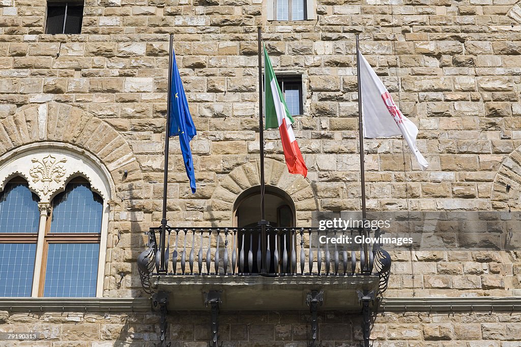 Low angle view of the balcony of a palace, Pallazo Vecchio, Piazza Della Signoria, Florence, Italy