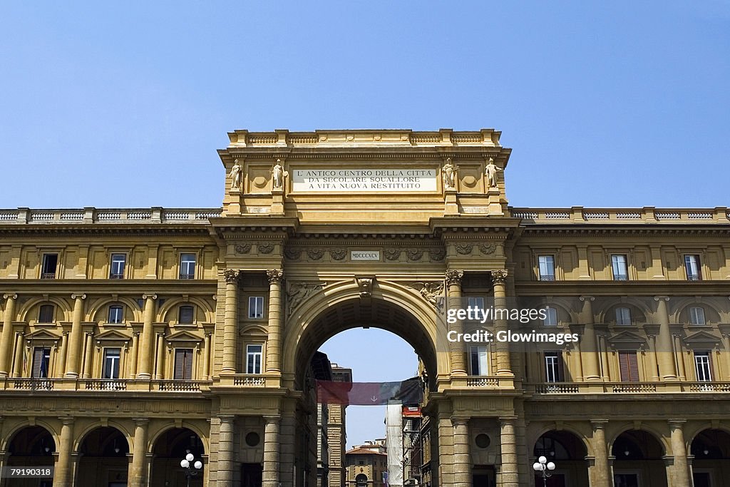 Low angle view of the entrance gate of a market square, Uffizi Museum, Florence, Tuscany, Italy