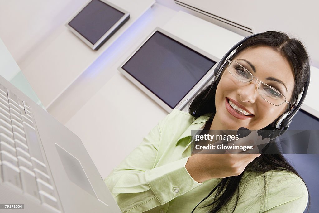 Portrait of a customer service representative talking on a headset