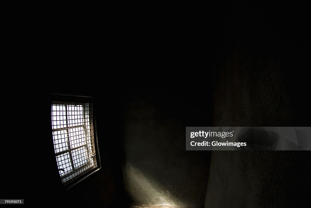 Sunlight entering a dark room through a window