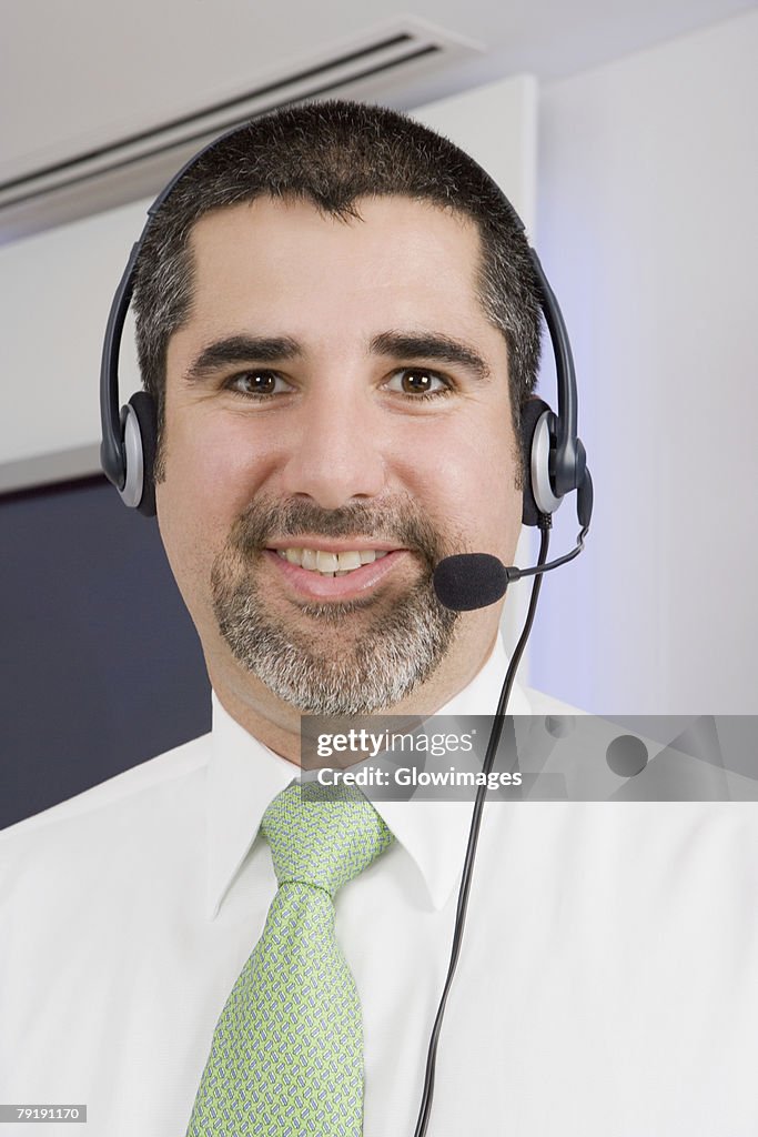 Portrait of a businessman wearing a headset and smiling