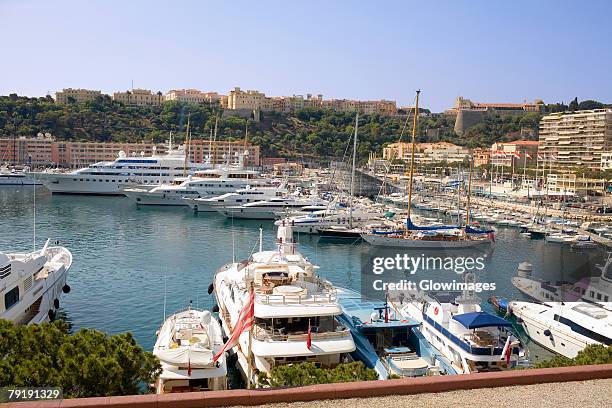 ferries and boats docked at a harbor, port of fontvieille, monte carlo, monaco - harbour of fontvieille stock pictures, royalty-free photos & images