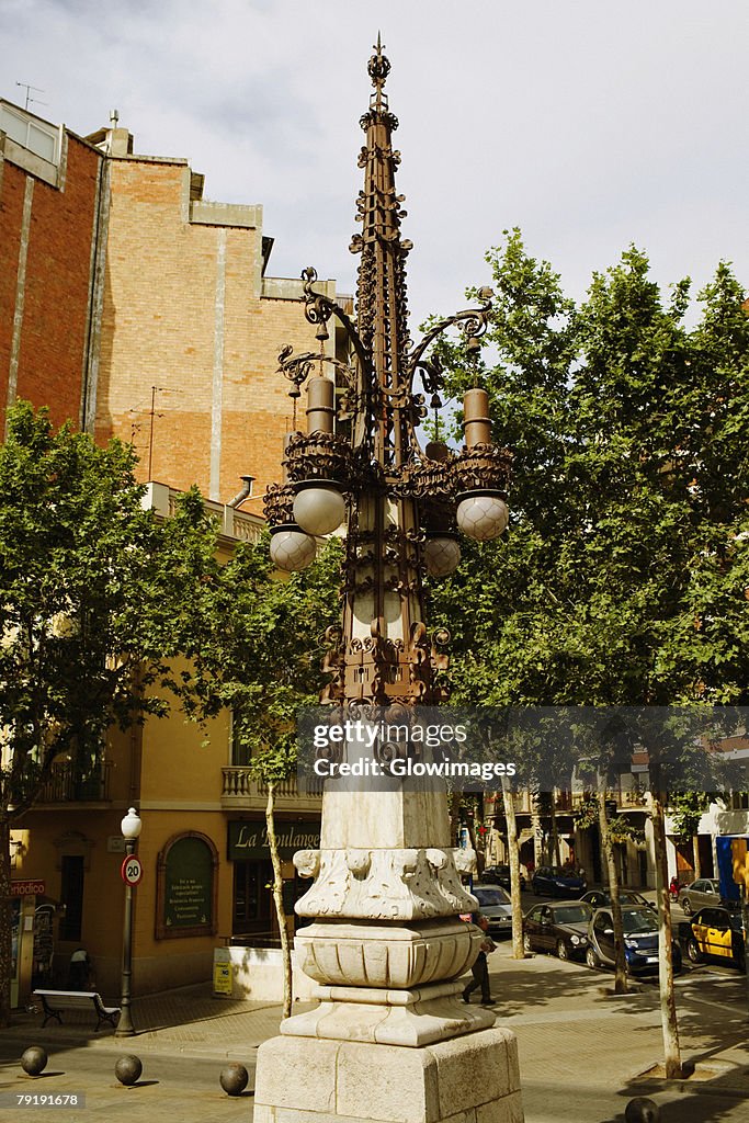 Lamppost in front of a building, Barcelona, Spain