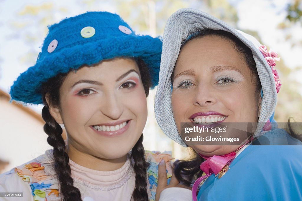 Portrait of a young woman and a mid adult woman smiling