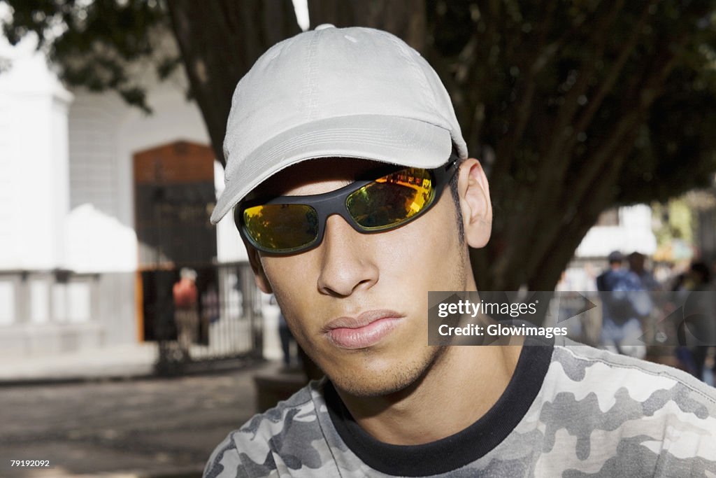 Close-up of a young man wearing sunglasses