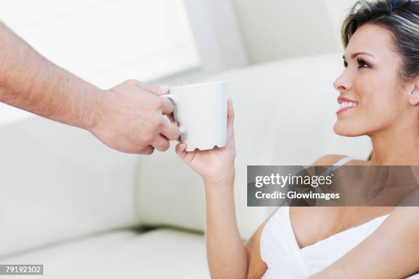 Handshake Over Tea Two Hands Tea Cup Photos and Premium High Res Pictures - Getty Images