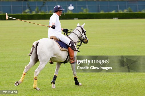 Side profile of a man playing polo Side profile of a man playing polo