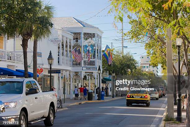 cars moving on the road, duval street, key west, florida, usa - duval street stockfoto's en -beelden