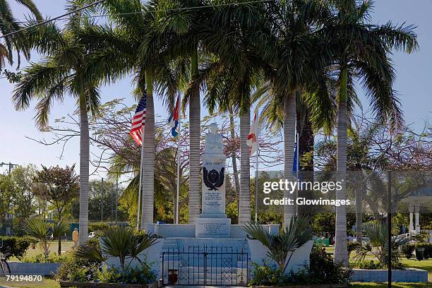 statue surrounded by flags in a park, bayview park, key west, florida, usa - monroe county florida stock pictures, royalty-free photos & images