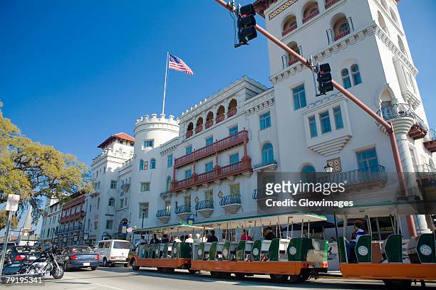 cable car in front of a building, st. augustine, florida, usa - saint augustine florida stock pictures, royalty-free photos & images