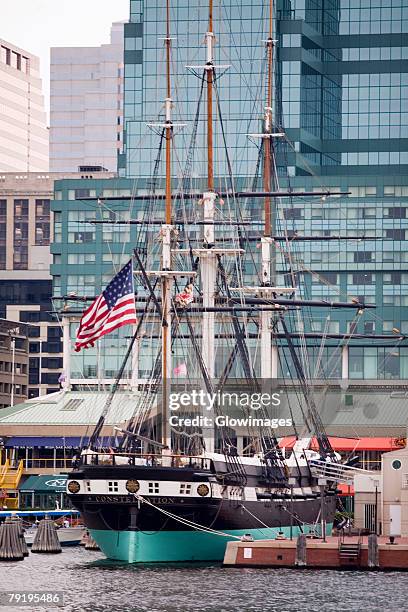 tall ship moored at a harbor, uss constellation, inner harbor, baltimore, maryland, usa - uss maryland stock pictures, royalty-free photos & images