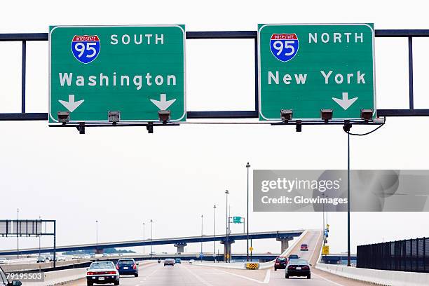 low angle view of road signboards over the road, baltimore, maryland, usa - straßenüberführung stock-fotos und bilder