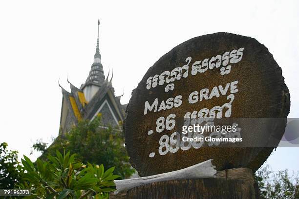 close-up of an information board in a graveyard, the killing fields, choeung ek, phnom penh, cambodia - choeung ek stock pictures, royalty-free photos & images