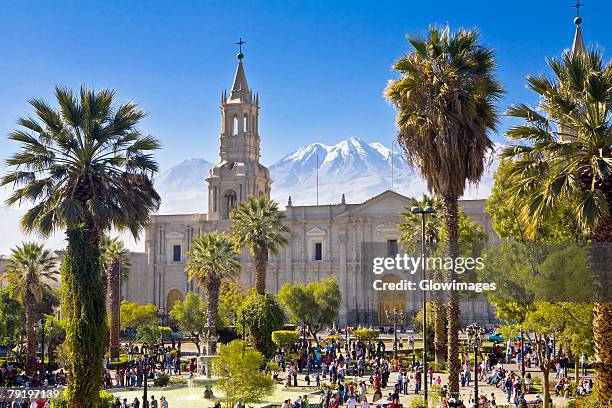 tourists in front of a cathedral, plaza-de-armas, arequipa, peru - arequipa peru stock pictures, royalty-free photos & images