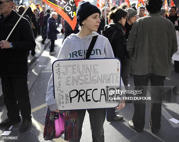 Woman demonstrates with French teachers and other public service employees in a street of Lyon, southeastern France, to protest against government's...