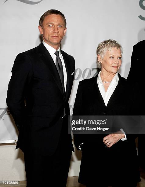 Actors Daniel Craig and Dame Judi Dench attend a photocall to celebrate the start of production of the 22nd James Bond film 'Quantum of Solace' at...
