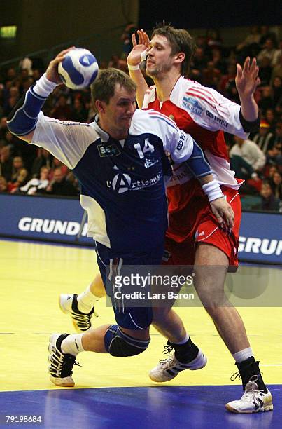 Christophe Kempe of France in action with Balazs Laluska of Hungary during the Men's Handball European Championship main round Group II match between...