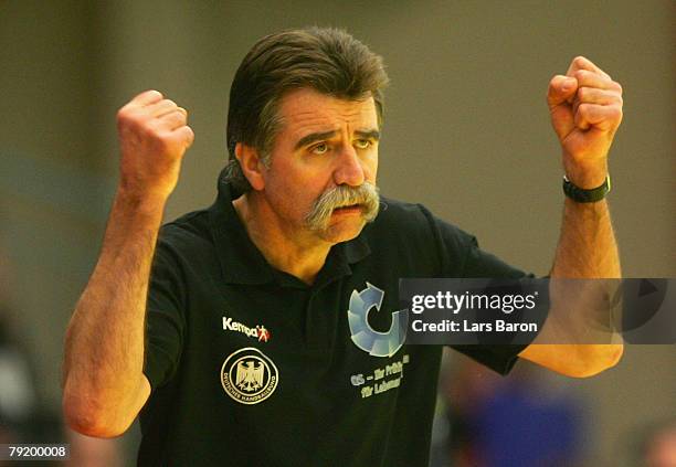 Coach Heiner Brand of Germany celebrates during the Men's Handball European Championship main round Group II match between Germany and Sweden at...