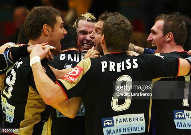 The german players celebrate after winning the Men's Handball European Championship main round Group II match between Germany and Sweden at Trondheim...