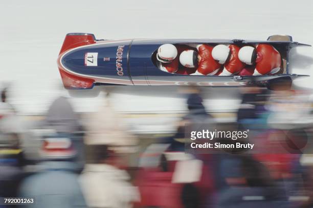Albert, Prince Grimaldi, Gilbert Bessi, Michel Vatrican and David Tomatis compete aboard Monaco I in the Four-man bobsleigh competition on 21...