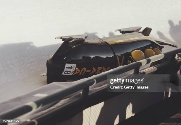 Devon Harris, Dudley Stokes, Michael White and Samuel Clayton of the Jamaica 1 crash out of the Four-man Bobsleigh competition on 28 February 1988...