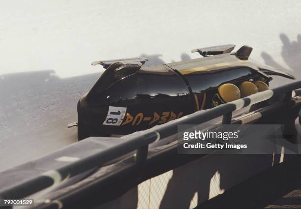 Devon Harris, Dudley Stokes, Michael White and Samuel Clayton of the Jamaica 1 crash out of the Four-man Bobsleigh competition on 28 February 1988...