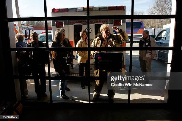 Supporters of Democratic presidential candidate former Sen. John Edwards peer inside the doors of the Anderson Homeland Park Fire Department Engine...