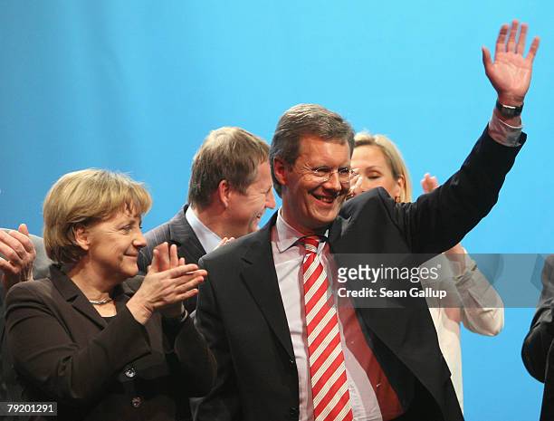 Christian Wulff , Christian Democrat and Governor of the German state of Lower Saxony, and German Chancellor Angela Merkel attend the last big...