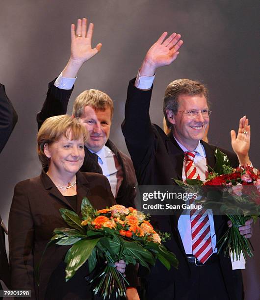 Christian Wulff , Christian Democrat and Governor of the German state of Lower Saxony, and German Chancellor Angela Merkel attend the last big...