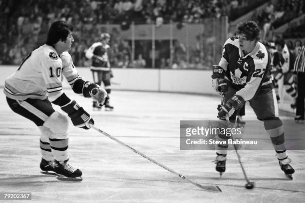 Darryl Sittler of the Toronto Maple Leafs and Carol Vadnais of the Boston Bruins skates at Boston Garden.