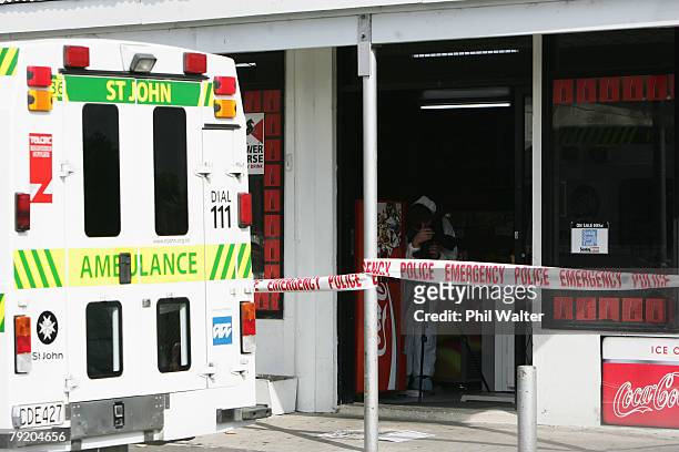 Police photographer records the scene at the Finlayson Superette in Clendon after an Auckland man was fatally stabbed in an attempted robbery January...