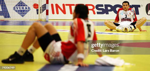 Ferenc Ilyes of Hungary sits dejected on the floor after loosing the Men's Handball European Championship main round Group II match between Hungary...