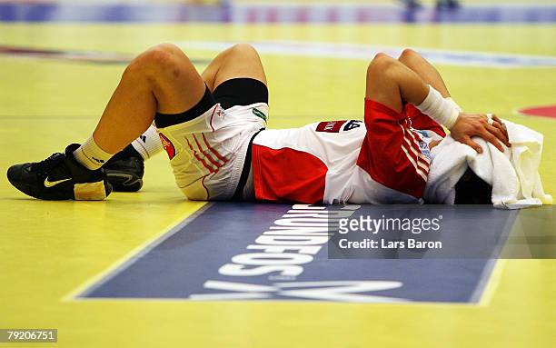 Laszlo Nagy of Hungary lies dejected on the floor after loosing the Men's Handball European Championship main round Group II match between Hungary...