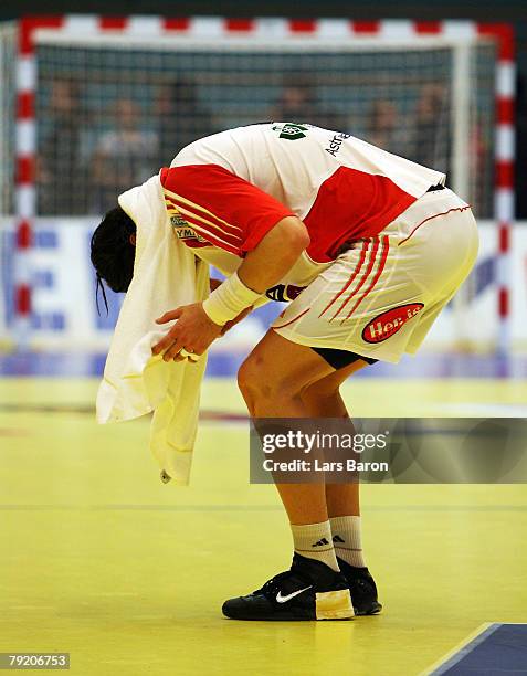 Laszlo Nagy of Hungary stands dejected on the floor after loosing the Men's Handball European Championship main round Group II match between Hungary...