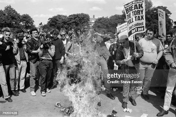 Protestors burn their Poll Tax documents in protest at what they see as an unfair levy, London, March 1990.
