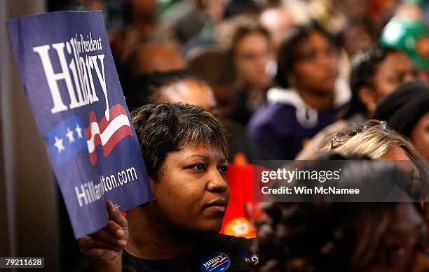 Supporters listen as Democratic presidential candidate Sen. Hillary Clinton speaks during a campaign event in the school chapel at Benedict College...