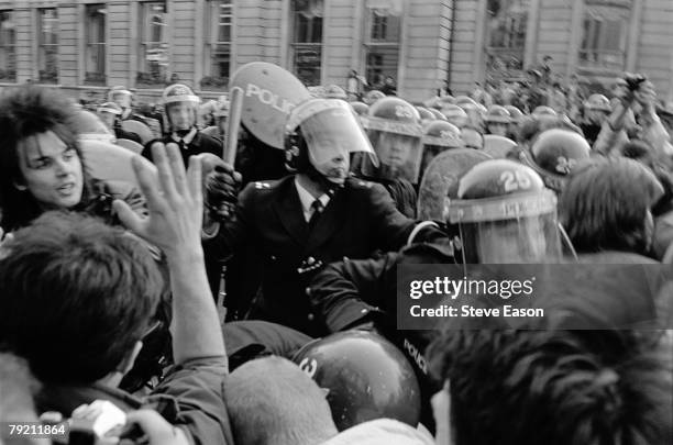 Police attempt to block off Whitehall as rioting breaks out during a demonstration against the Poll Tax, London, 31st March 1990.