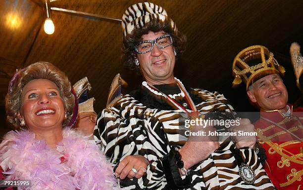 Bavarian Minister for European Affairs Markus Soeder , his wife Karin and Erwin Huber, head of the Christian Social Union , disguised with a fancy...