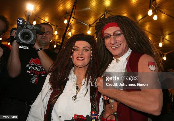 German politicians Franz Maget and Margarete Bause, disguised with a fancy dress, attend the live broadcast of the annual show "Karneval in Franken"...