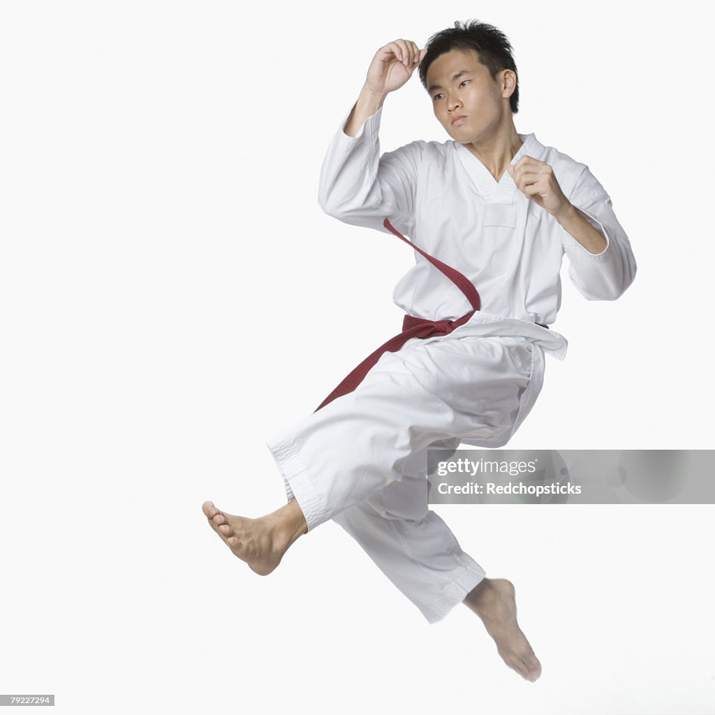 Young man posing in mid-air