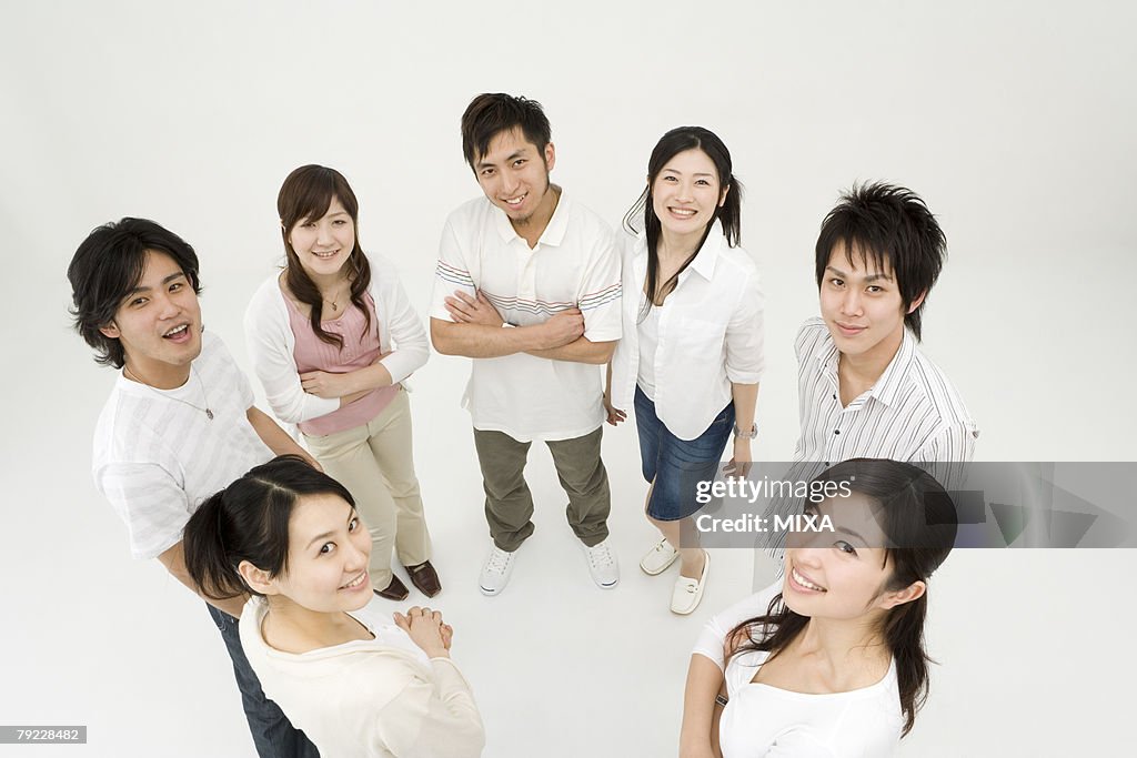 Young people standing in circle