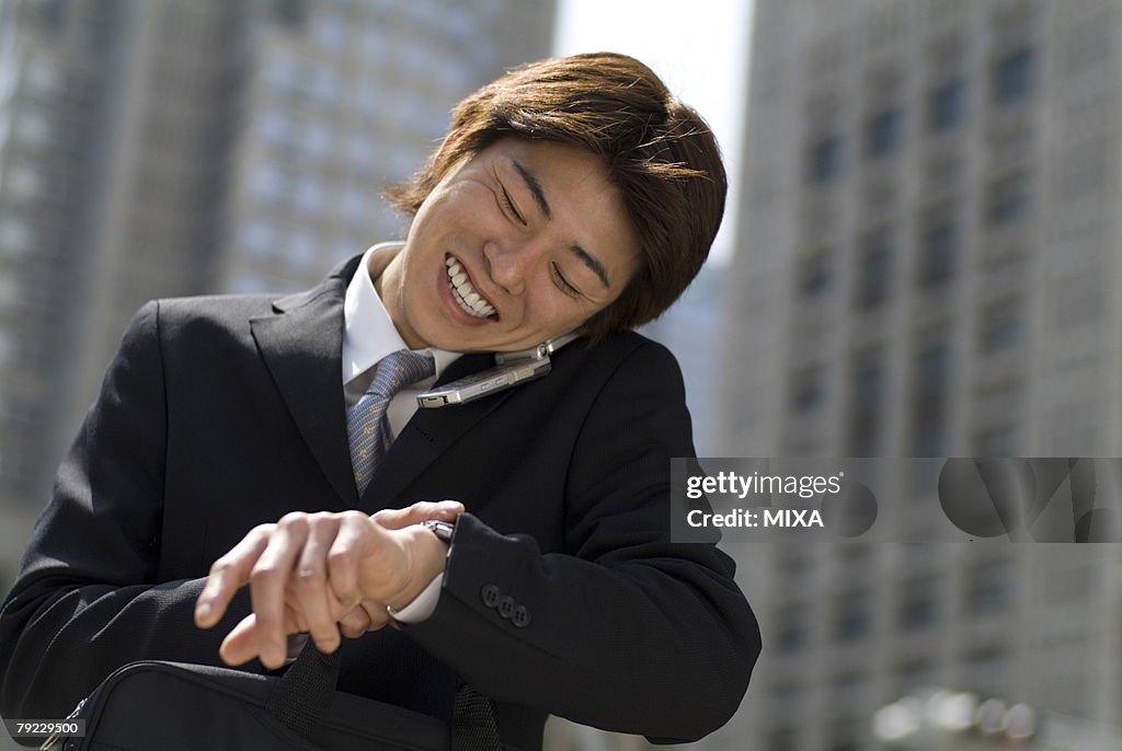 Young businessman talking over mobile phone