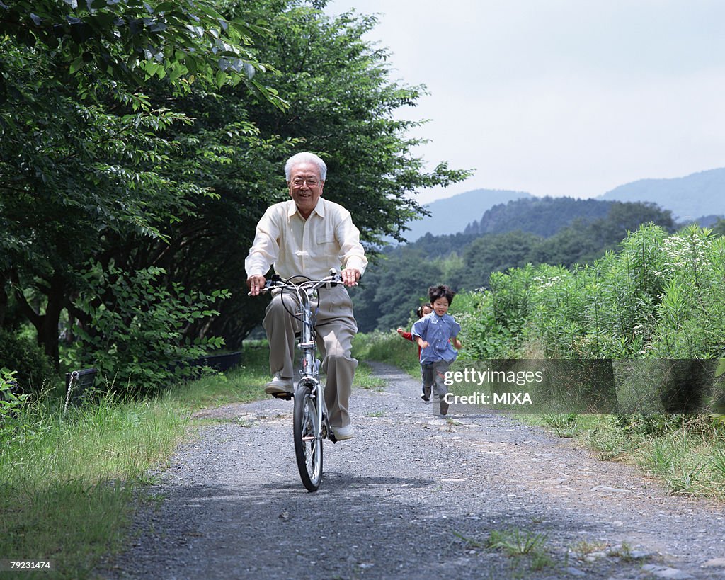 A grand father riding a bicycle