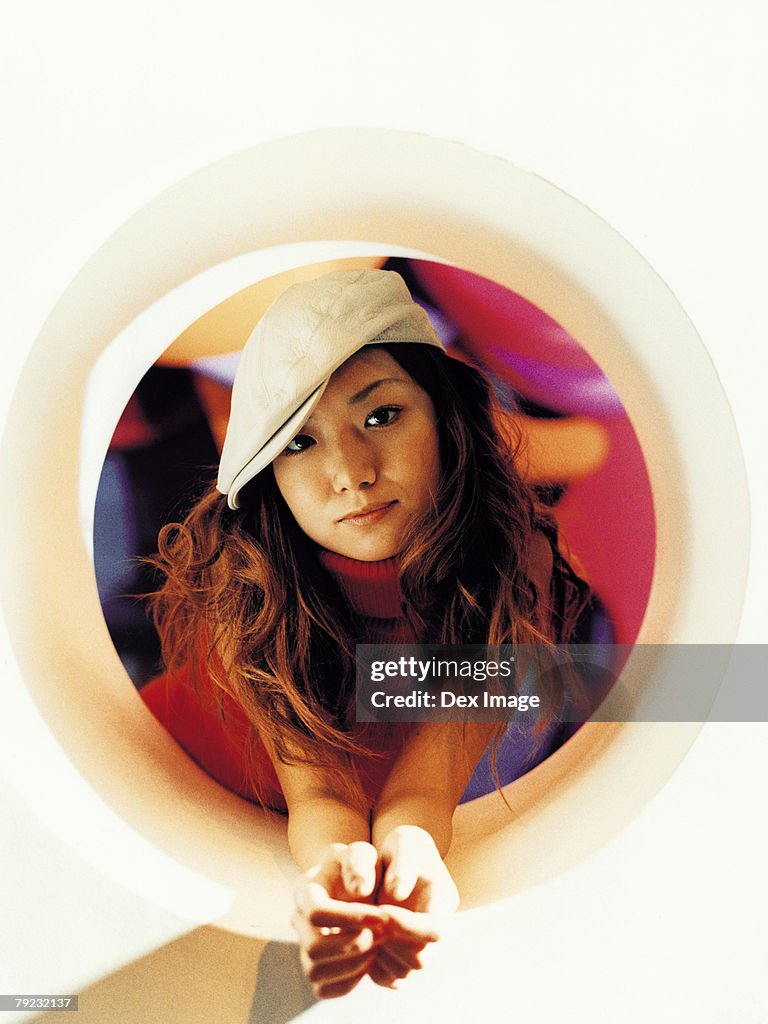 Young Asian woman, round shape window