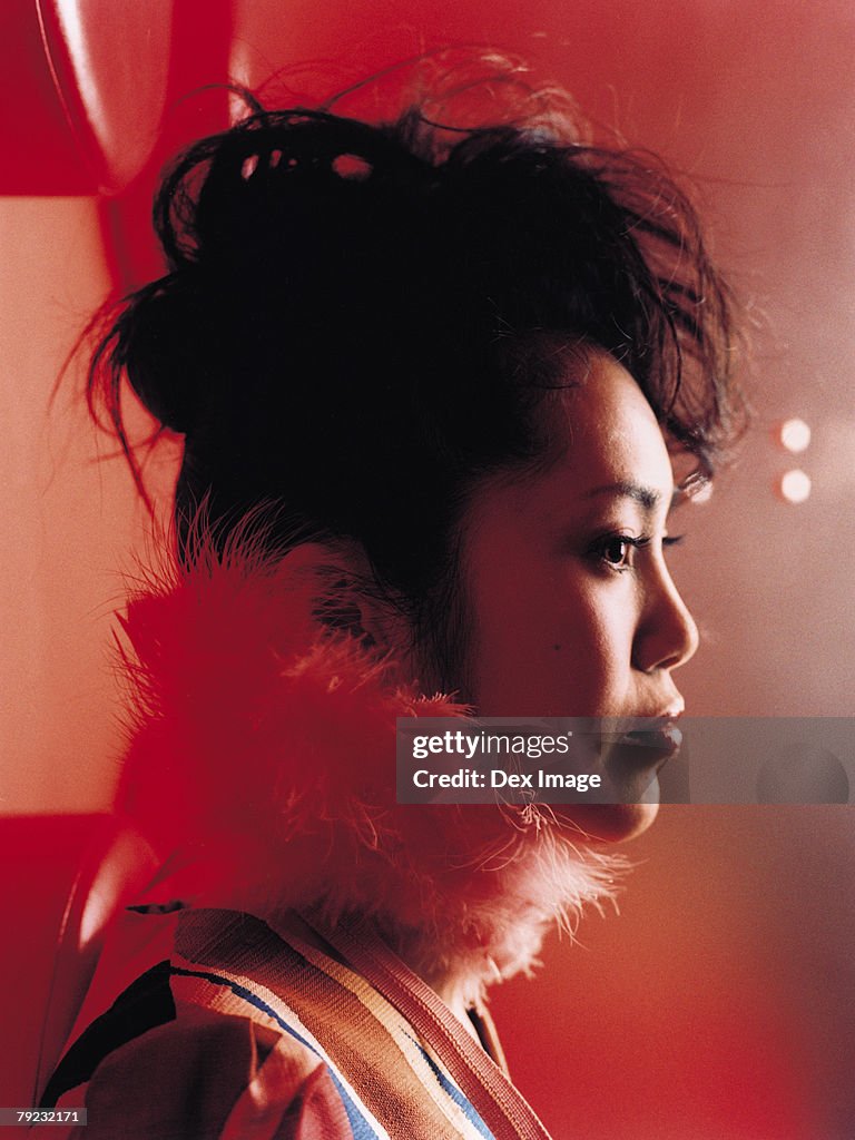 Young Asian woman, profile, close-up